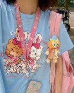 Close-up of a MIKKO printed shirt featuring a kawaii character design and accessories.