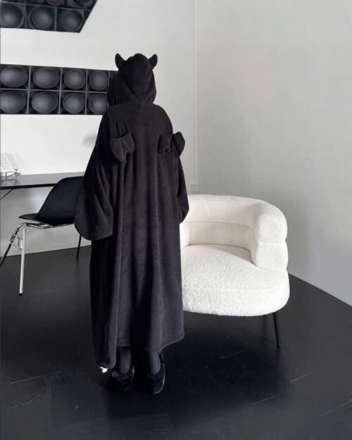 Black little devil pajamas loungewear in a room setting.