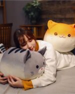 Kawaii chonky cat plushie - Loaf Bread Edition, two plush toys on a bed.