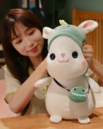 A soft, kawaii bunny plushie with a green hat, perfect aesthetic rabbit toy.