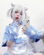 Model wearing a blue gamer girl shirt with pixel graphics and cat ears.