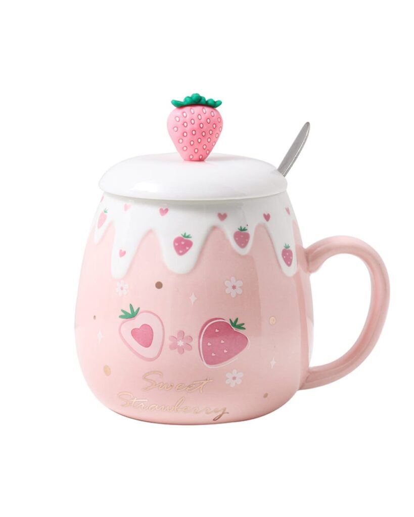 Pink strawberry ceramic mug with a lid and spoon, decorative design.