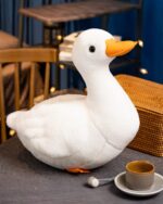 Goosy the White Duck Plushie, a soft, white plush toy duck.