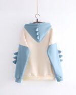 Light blue and white dinosaur hoodie with arm details, a product_keyword.