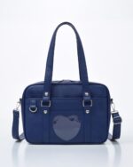 Navy blue japanese schoolbag featuring a heart-shaped window and multiple compartments.