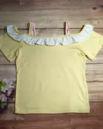 Yellow yume kawaii crop top with white ruffles and thin straps.