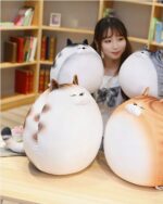 Kawaii Extra Chonky Cat Plushie - Round Edition, multiple plushies displayed on a table.