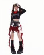 Close-up of a punk plaid denim skirt with ruffles, featuring a Y2K aesthetic.