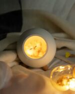 Kawaii cat lamp shaped night light with a warm glow, resting on wooden legs.