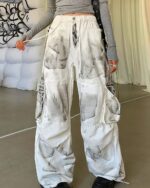 Washed y2k artsy pants featuring a graphic print design.