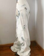 Washed out y2k artsy pants featuring a unique, distressed design and multiple pockets.