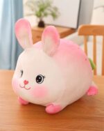 Kawaii Strawberry Bunny Plushie, a soft pink and white plush rabbit with a strawberry design.