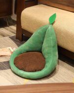 Green kawaii fruit cushion shaped like a pear with a brown base and leaf.