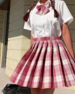 Pink and white jk plaid skirt with pleated details, kawaii style.