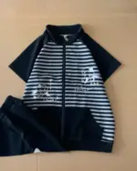 Dark blue japanese striped loungewear with cat illustrations on the sleeves and chest.