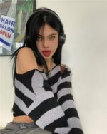 Off-the-shoulder retro aesthetic sweater featuring a striped design and coquette clothing style.