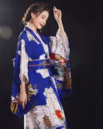 Blue and white satin japanese kimono featuring floral and pagoda designs.