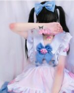 Back view of a yume kawaii maid dress featuring pink and white layers, blue accents, and My Melody details.