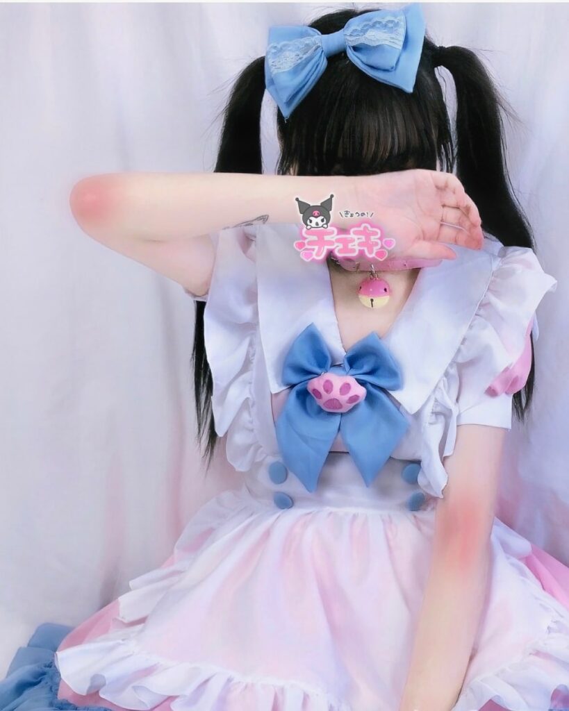 Back view of a yume kawaii maid dress featuring pink and white layers, blue accents, and My Melody details.