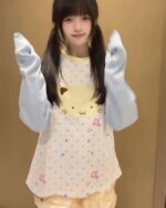 Harajuku cat sweatshirt featuring a cute cat design on a pastel patterned top.