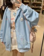 Light blue puppy hoodie with bear and star embroidery, kawaii clothes design.