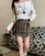 Laced Pleated Skirt - Korean aesthetic skirt, displaying a pleated design and lacing detail.