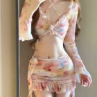 Four-piece kawaii aesthetic swimsuit featuring a floral print top and layered skirt.