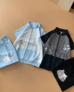 Three pieces of japanese striped loungewear, featuring zippered jackets and shorts with cute character prints.