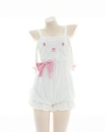 White plush bunny pajamas featuring a bow and bunny face detail. Cute and comfortable sleepwear.