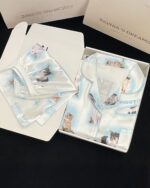Kitty silky pajamas set featuring kawaii cat illustrations on a satin fabric.