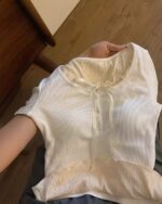 Vintage aesthetic sweatshirt with knitted bow and lace details, cream color.