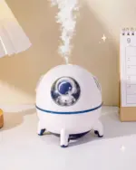 Kawaii Mini Spaceship Humidifier emitting mist on a desk.
