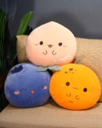 Kawaii fruit plushie cushion set featuring peach, blueberry, and orange designs.