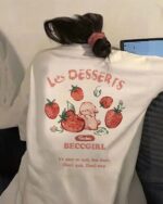 Short sleeve strawberry bunny t-shirt featuring a pink bunny and strawberries.