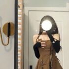 Brown retro aesthetic dress featuring a suspender bodice and layered skirt.