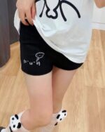 Cute Cotton Black Shorts - Kaomoji aesthetic shorts showing a black and white graphic print.