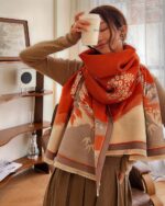 Vegan cashmere scarf featuring a floral autumn design, wide knit style.