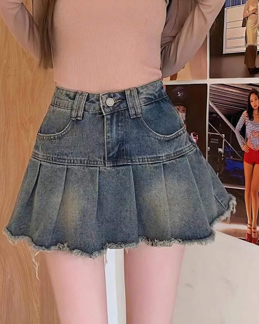 Blue denim y2k aesthetic skirt with pleats and frayed edges.