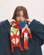 Cute fox scarf featuring a cottage aesthetic design, knitted with colorful patterns.