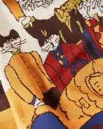 Close-up of a cat reunion sweater featuring a retro-style illustration of cats in various poses.