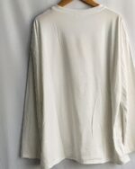 White panda print t-shirt hanging on a hanger.