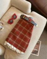 Red plaid mini skirt with lace trim, a preppy aesthetic skirt.