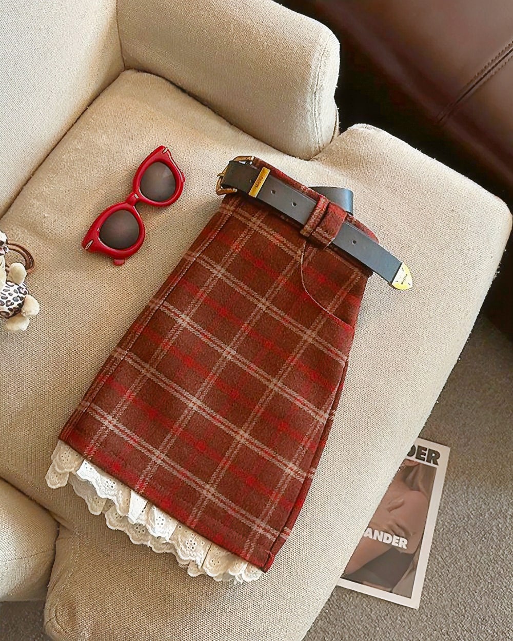 Red plaid mini skirt with lace trim, a preppy aesthetic skirt.