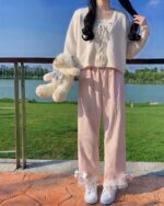 Laced Casual Pants - Kawaii Clothes, pink wide-leg pants with lace trim, outdoors.