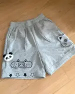 Gray kawaii neko shorts featuring cat, panda, and star designs.