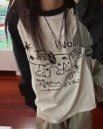 Long sleeve dog doodle t-shirt featuring a black and white doodle design.