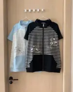 Japanese striped loungewear set, featuring a zip-up top and a short-sleeved shirt with kawaii character designs.