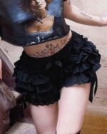 Black puffy gothic coquette skirt with layered ruffles and lace trim, showcasing a dark aesthetic.