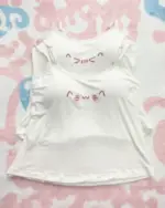White cutecore aesthetic vest with kawaii kaomoji symbols.