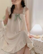 Light cute pajamas featuring a soft, ruffled design and bow detail. Soft girl pajamas.